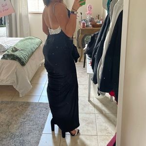 Backless beaded v-neck prom dress with train. Very classy and flattering cut.